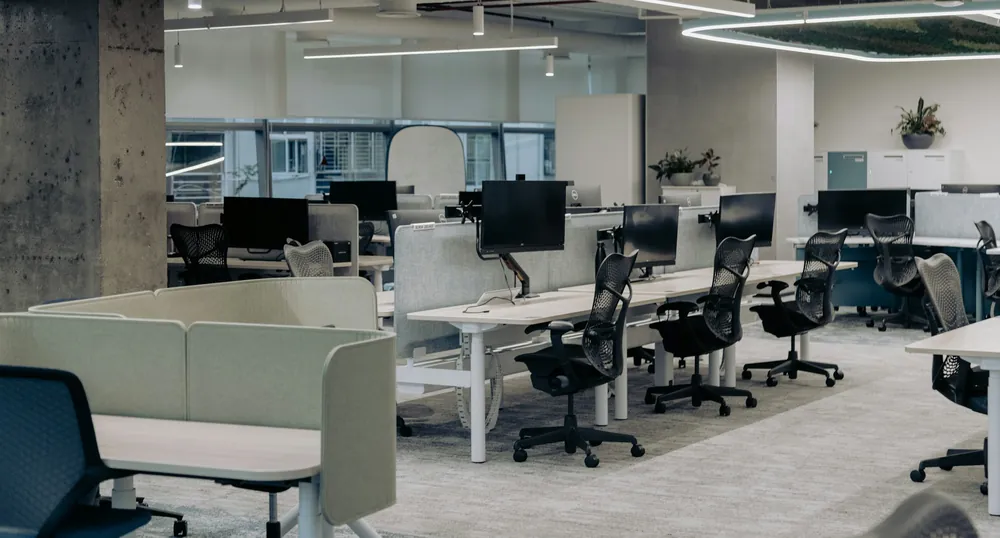 Clean open-plan office with workstations and large windows