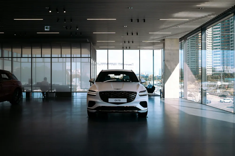 Spotless car dealership showroom with a vehicle on display